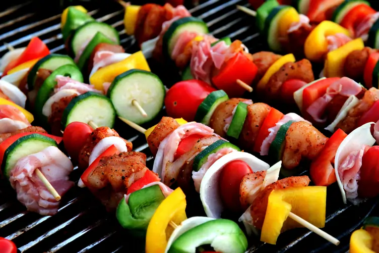 Colourful kebabs on a grill about to be cooked
